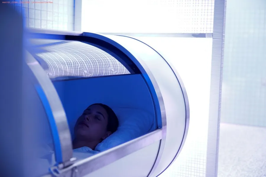 A guest rests inside a hyperbaric oxygen capsule at COMO Shambhala in Singapore