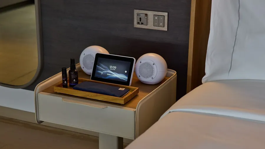 SleepHub speakers and control screen on a bedside table at COMO Metropolitan Singapore